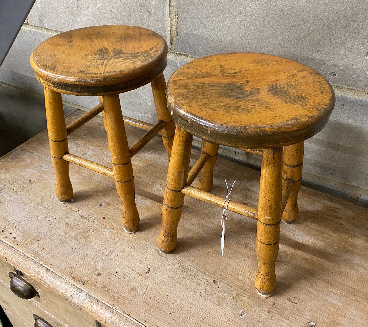 A pair of stained beech childs stools, height 33cm